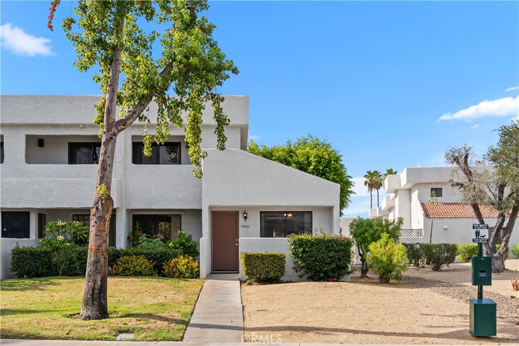 69646 Antonia Way Rancho Mirage, CA 92270 - Photo 6 of 50 a front view of a house with a yard