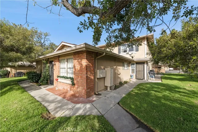 a front view of a house with garden