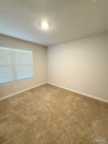 an empty room with a empty space and window