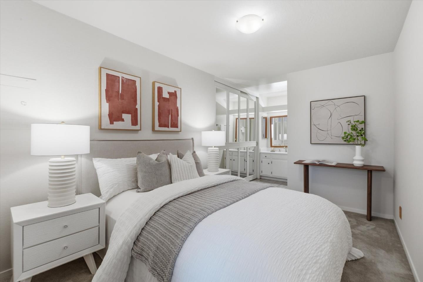 255 South Rengstorff Avenue, Unit 58 Mountain View, CA 94040 - Photo 18 of 27 a bedroom with a bed and a lamp on dresser