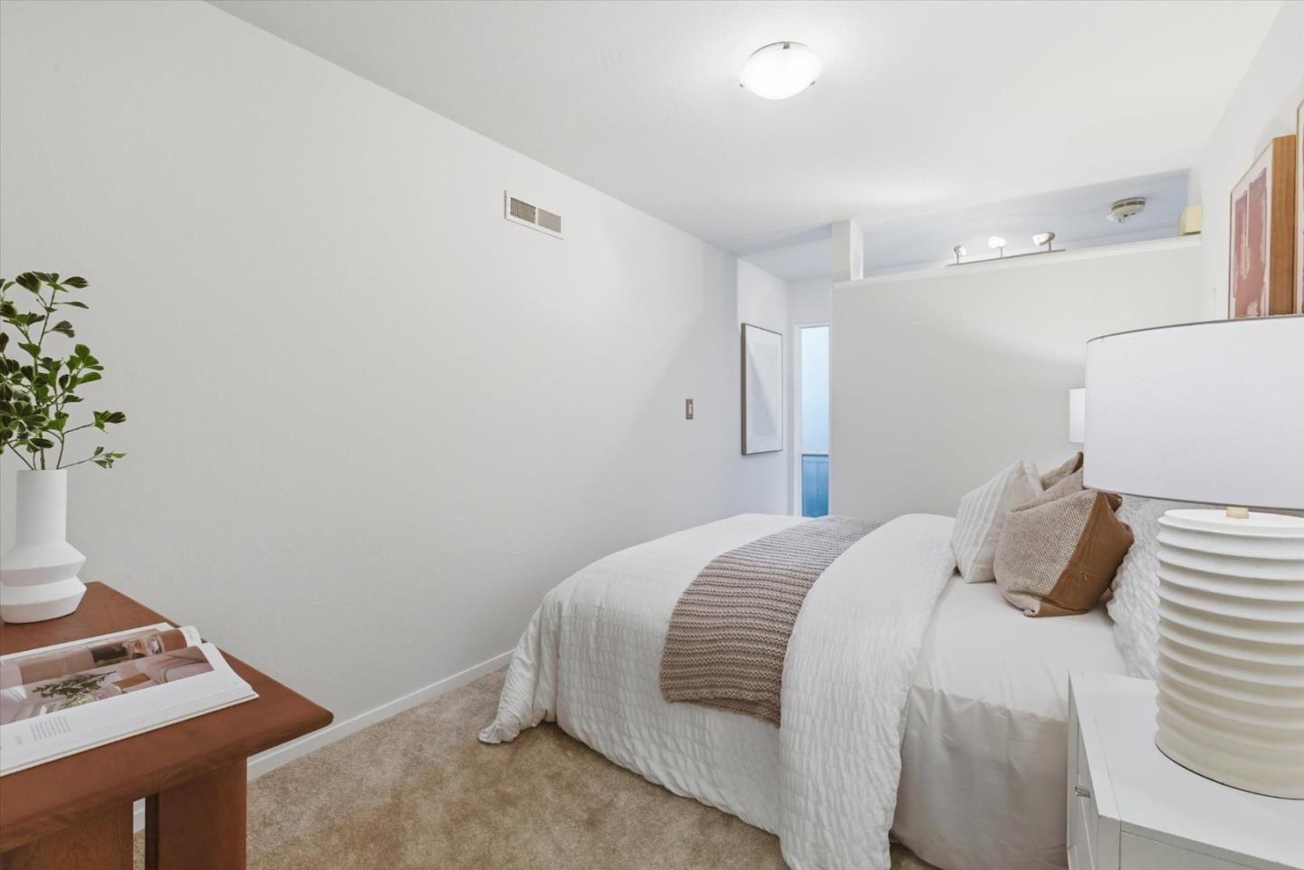 255 South Rengstorff Avenue, Unit 58 Mountain View, CA 94040 - Photo 19 of 27 a bedroom with a bed and a window