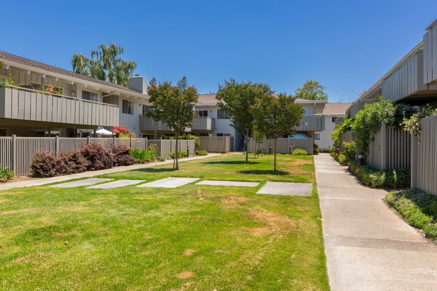 255 South Rengstorff Avenue, Unit 58 Mountain View, CA 94040 - Photo 24 of 27 a swimming pool with yard in front of it