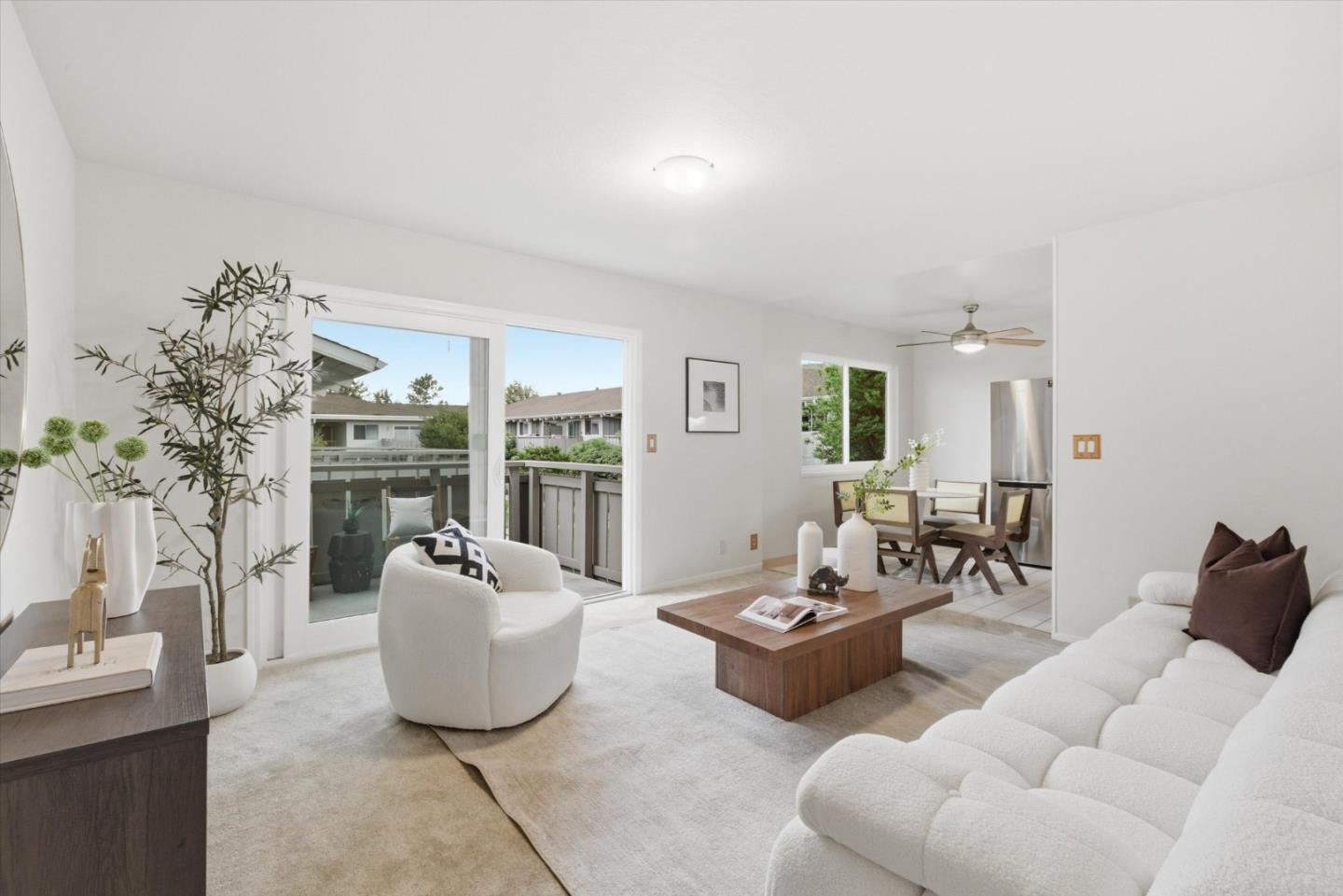 255 South Rengstorff Avenue, Unit 58 Mountain View, CA 94040 - Photo 5 of 27 a living room with furniture and a chandelier