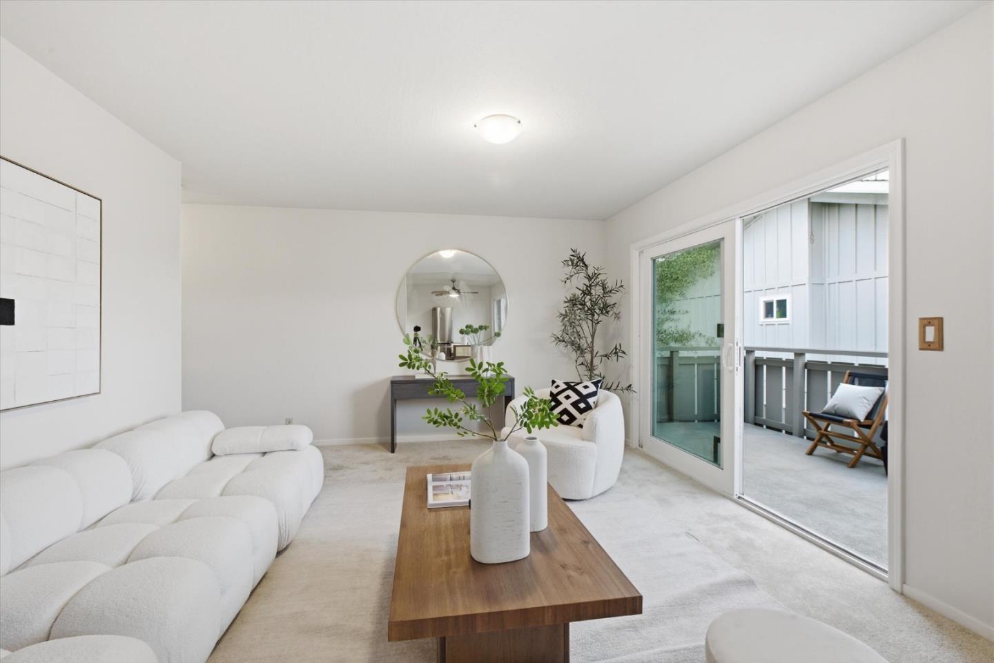 255 South Rengstorff Avenue, Unit 58 Mountain View, CA 94040 - Photo 8 of 27 a living room with furniture and a view of bedroom