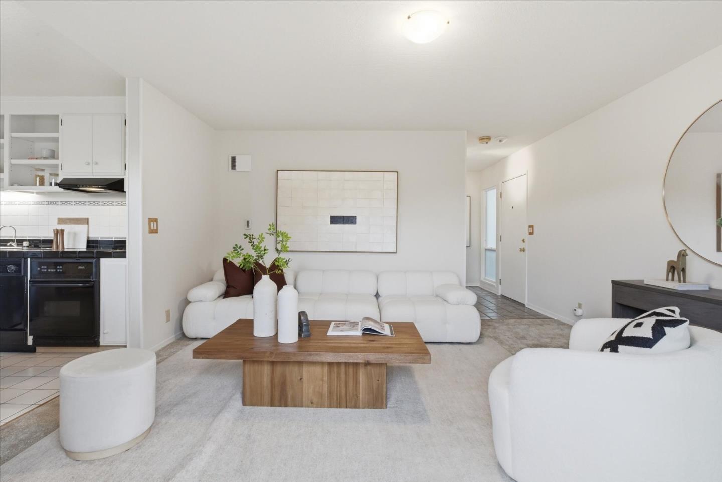 255 South Rengstorff Avenue, Unit 58 Mountain View, CA 94040 - Photo 9 of 27 a living room with furniture and a potted plant