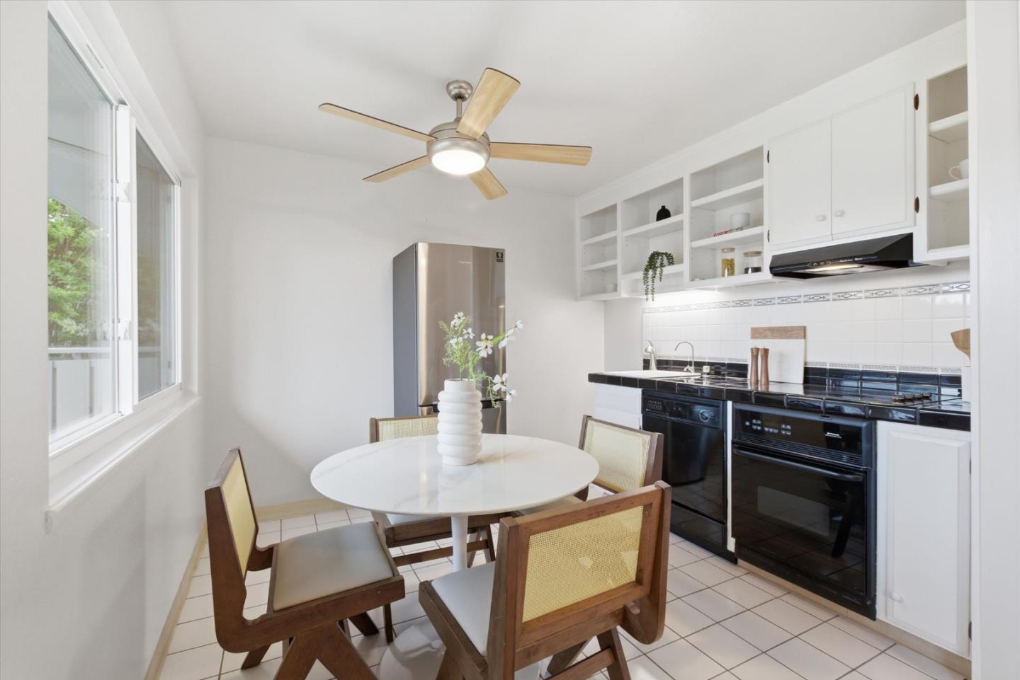 255 South Rengstorff Avenue, Unit 58 Mountain View, CA 94040 - Photo 10 of 27 a kitchen with stainless steel appliances a stove a sink and a refrigerator