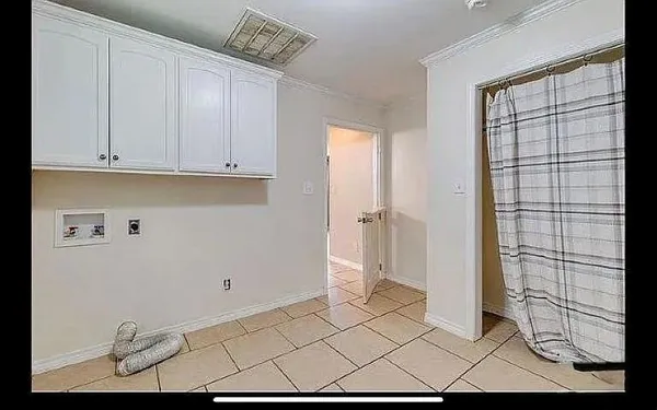 an empty room with closet and chandelier fan
