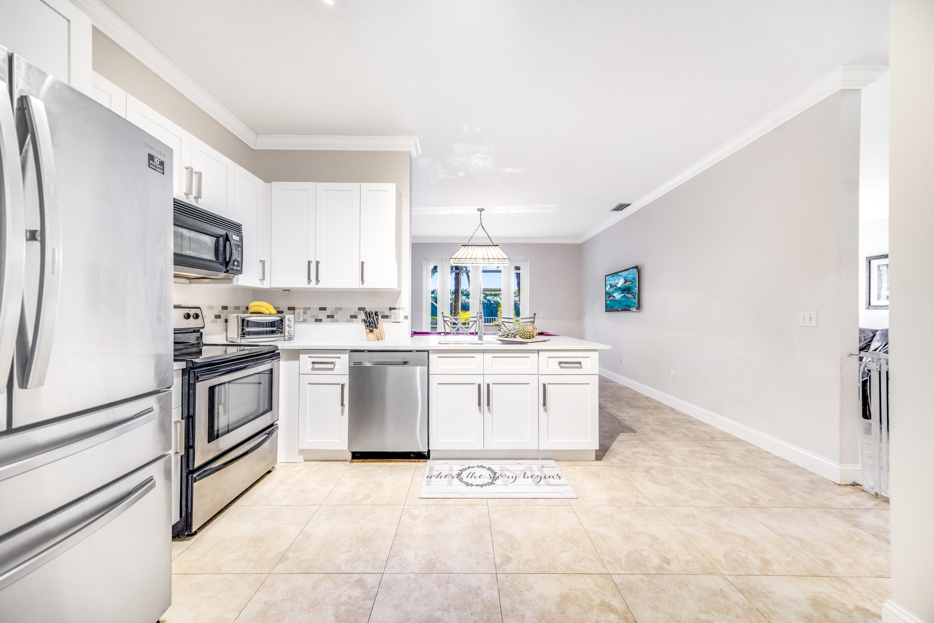 5236 Eagle Cay Way Coconut Creek, FL 33073 - Photo 11 of 33 a kitchen with a sink cabinets and stainless steel appliances