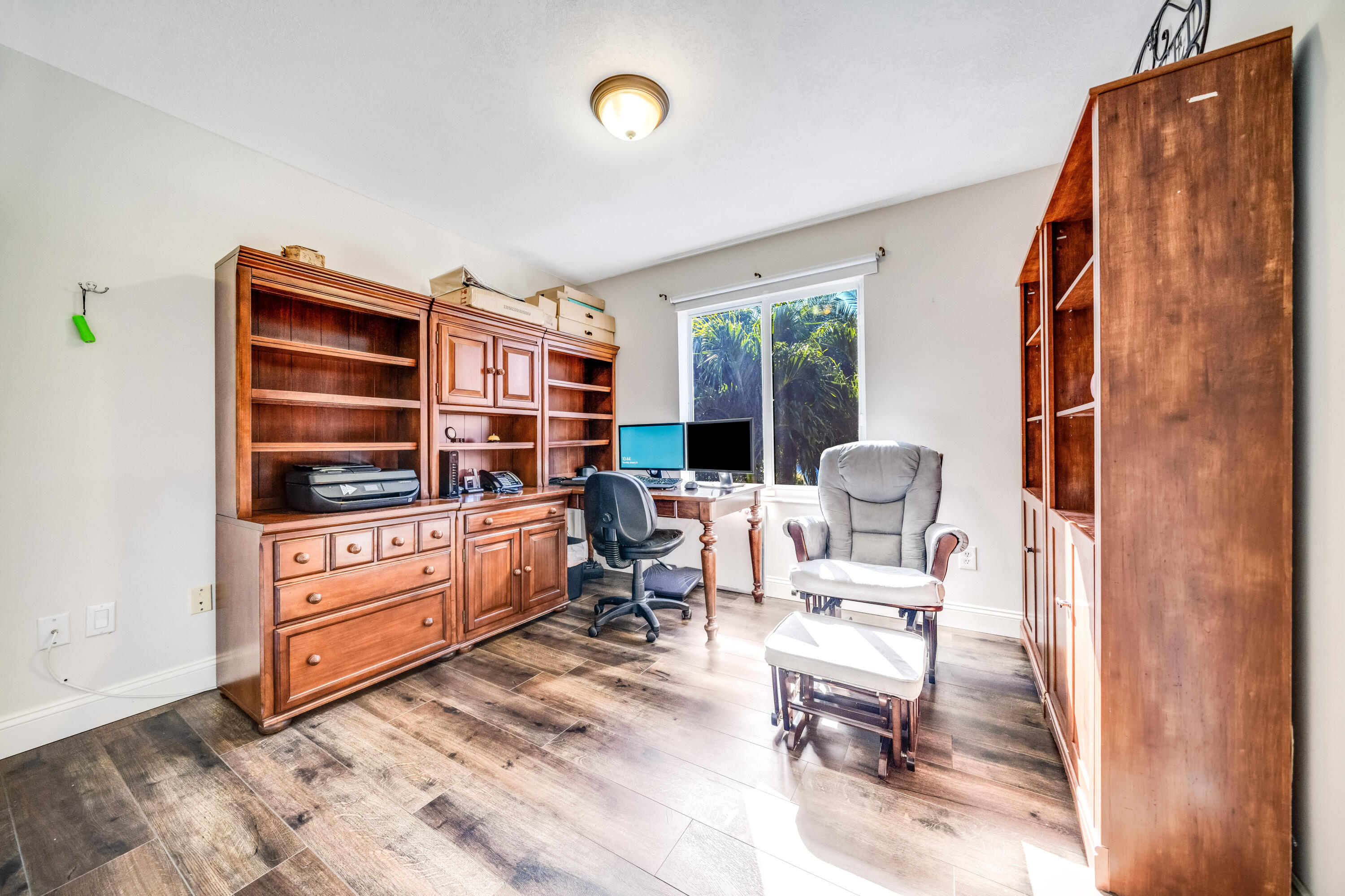 5236 Eagle Cay Way Coconut Creek, FL 33073 - Photo 21 of 33 a living room with furniture cabinets and a window