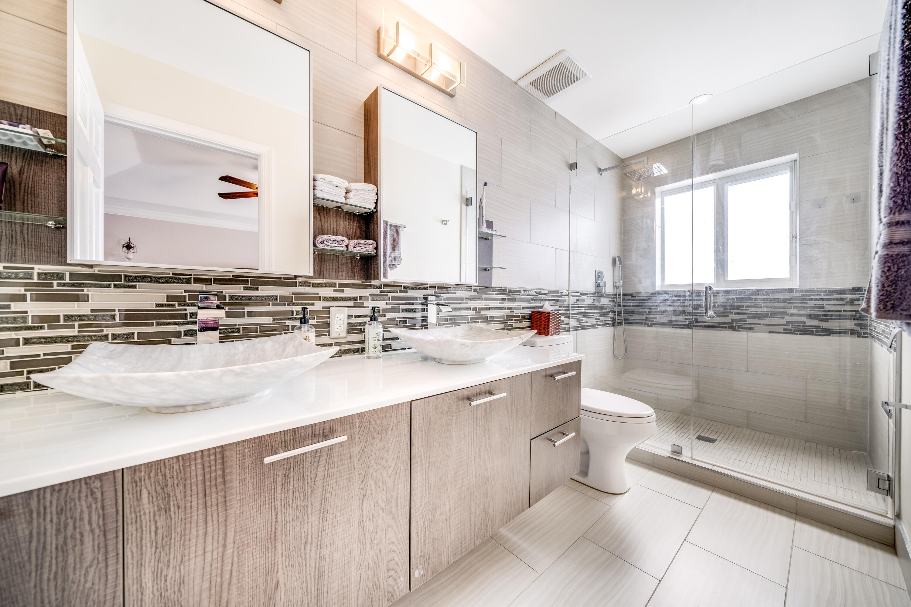 5236 Eagle Cay Way Coconut Creek, FL 33073 - Photo 23 of 33 a bathroom with a sink a toilet and mirror