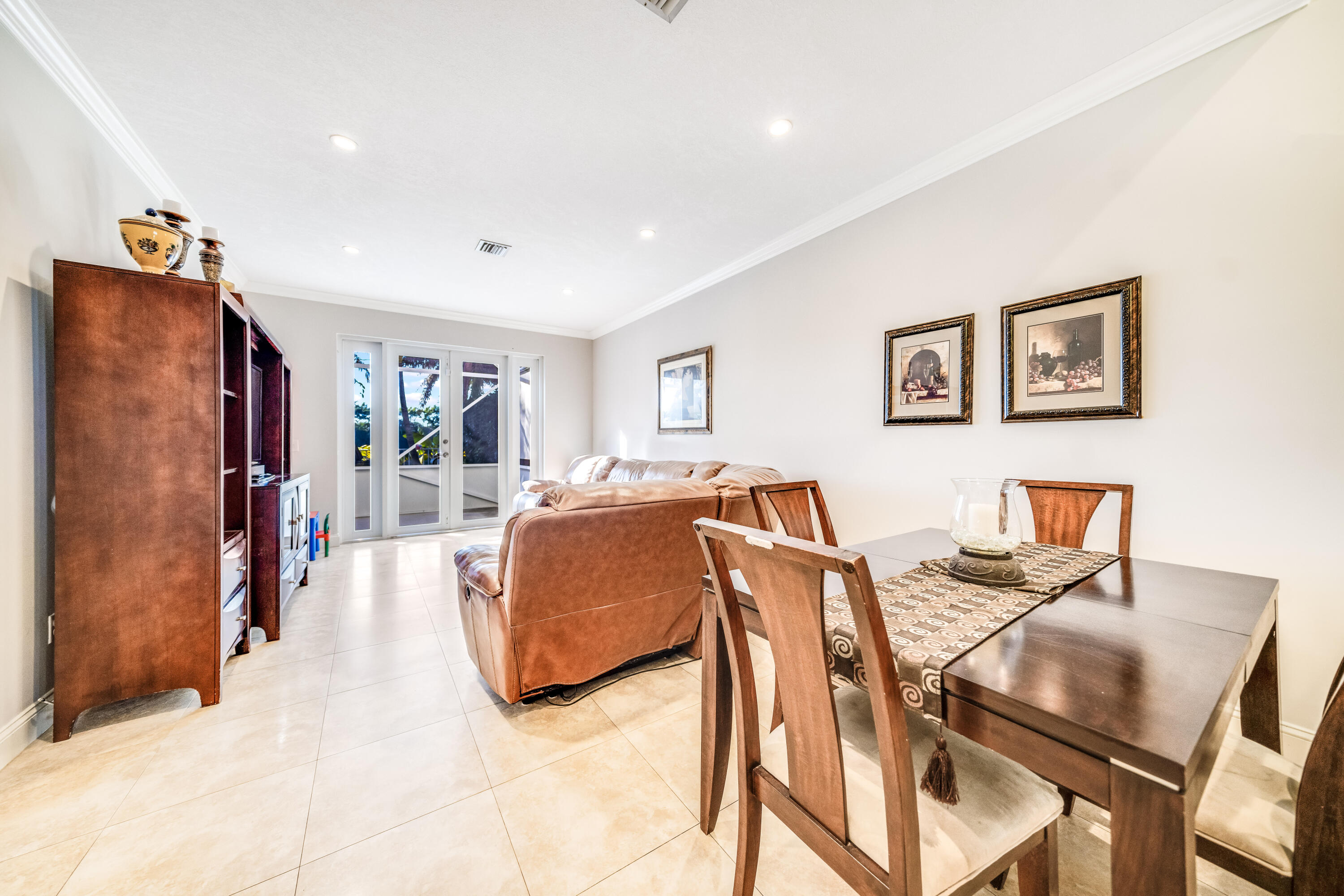 5236 Eagle Cay Way Coconut Creek, FL 33073 - Photo 6 of 33 a living room with furniture and a flat screen tv
