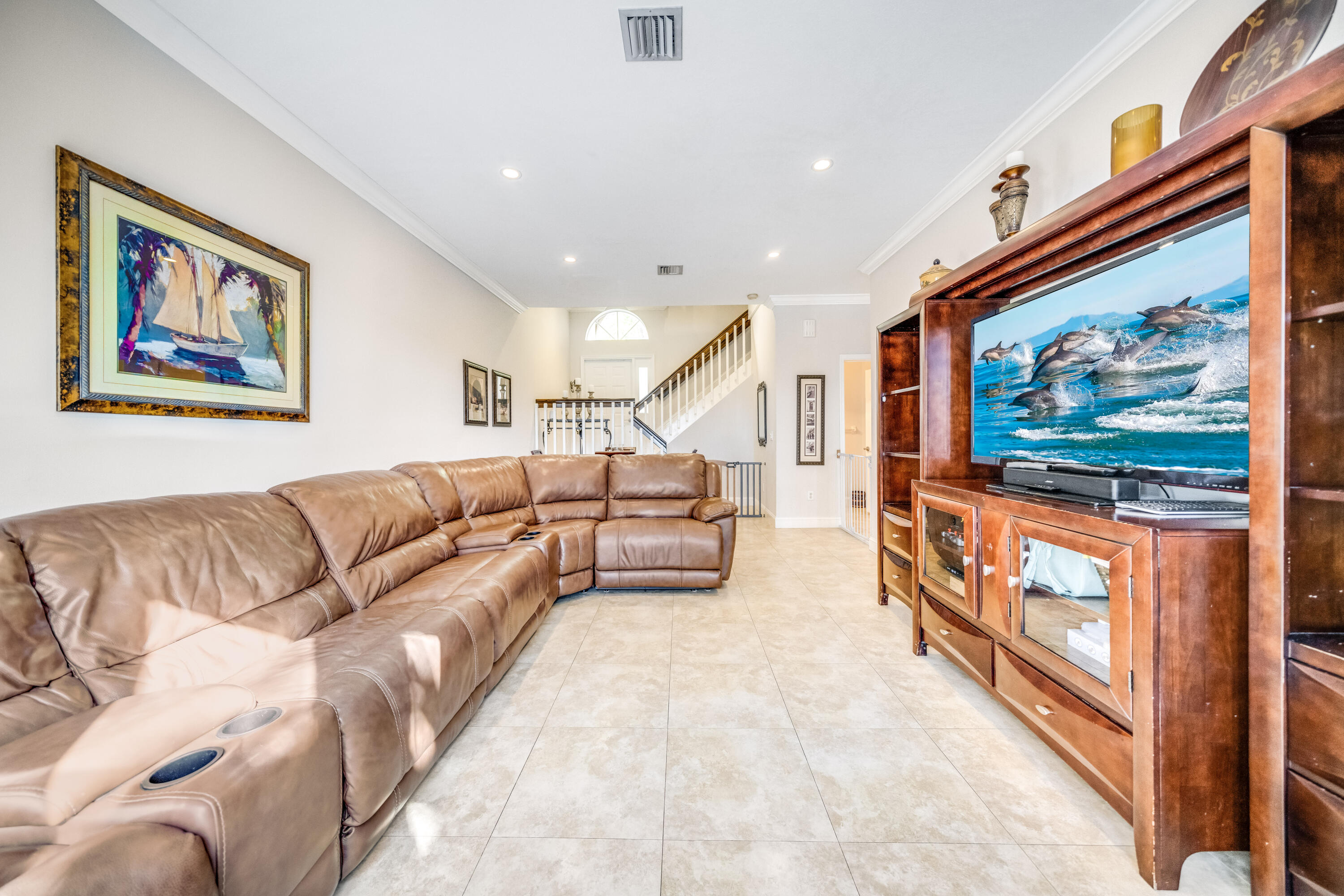 5236 Eagle Cay Way Coconut Creek, FL 33073 - Photo 7 of 33 a living room with furniture and a flat screen tv
