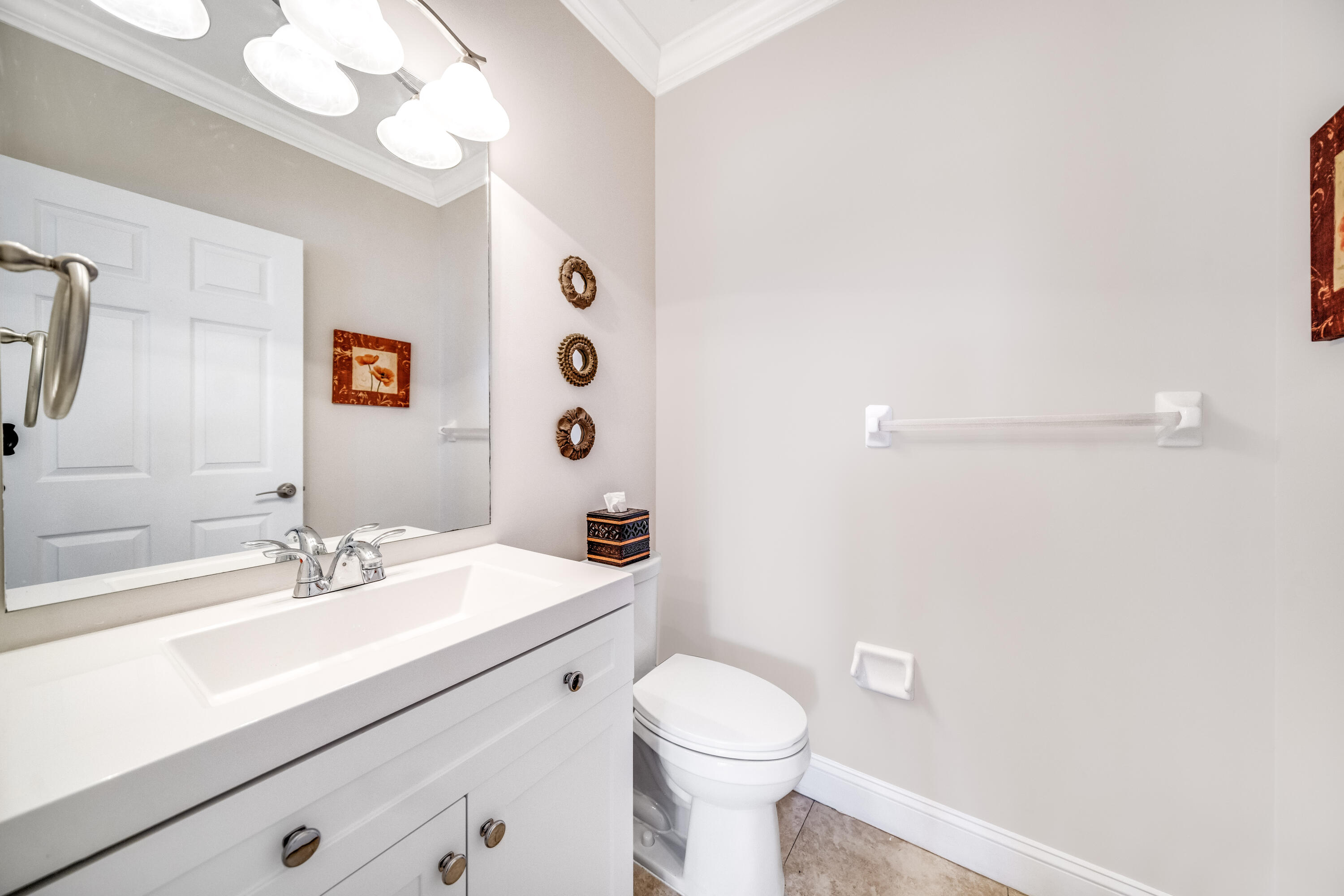 5236 Eagle Cay Way Coconut Creek, FL 33073 - Photo 8 of 33 a bathroom with a sink a toilet and a mirror