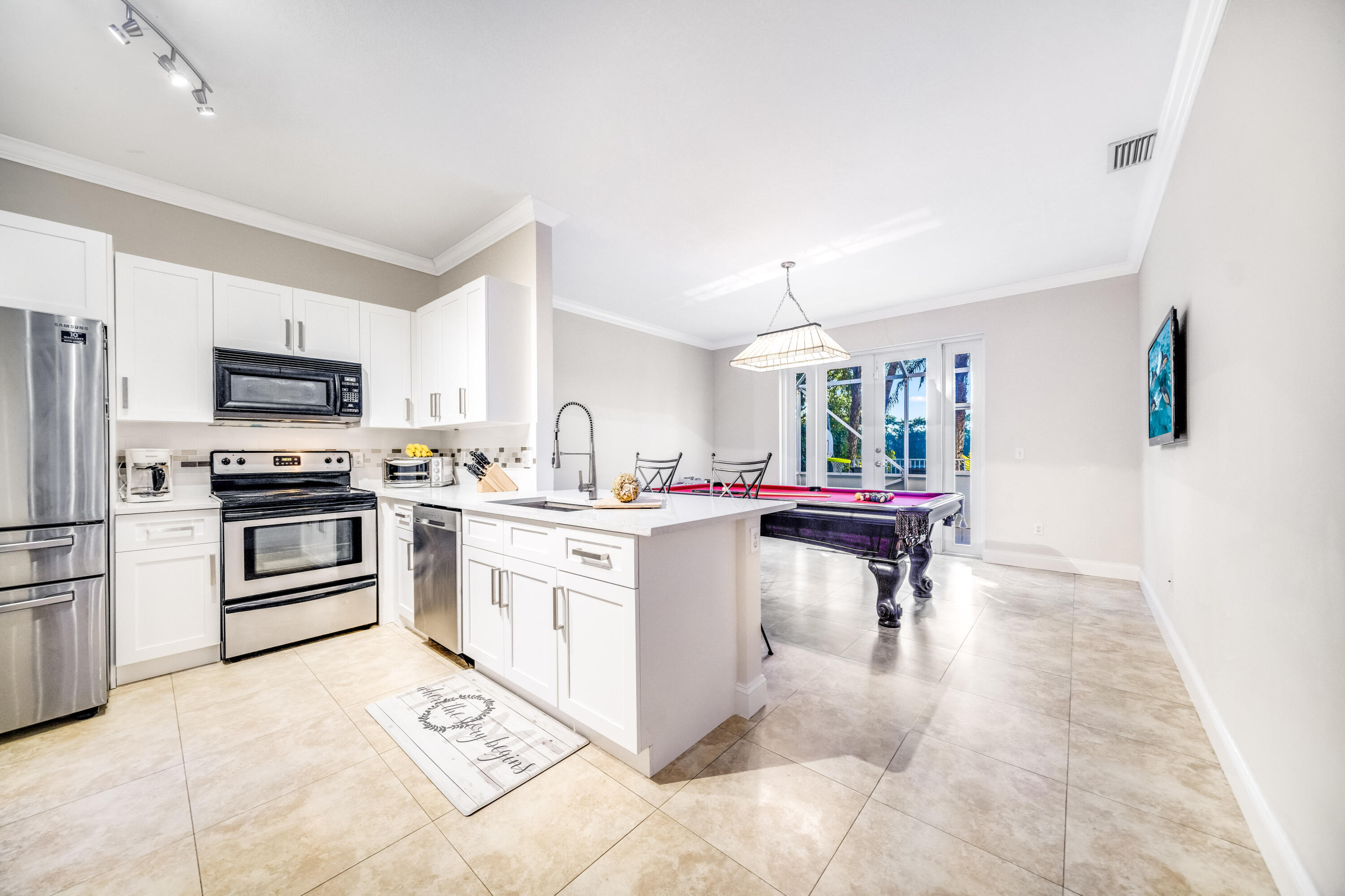 5236 Eagle Cay Way Coconut Creek, FL 33073 - Photo 10 of 33 a kitchen with cabinets and chairs