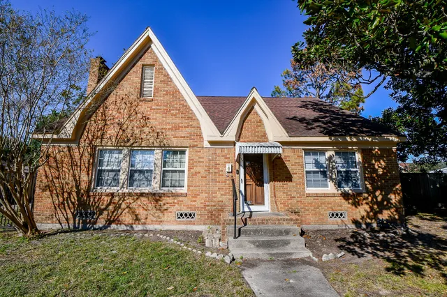 front view of a house with a yard