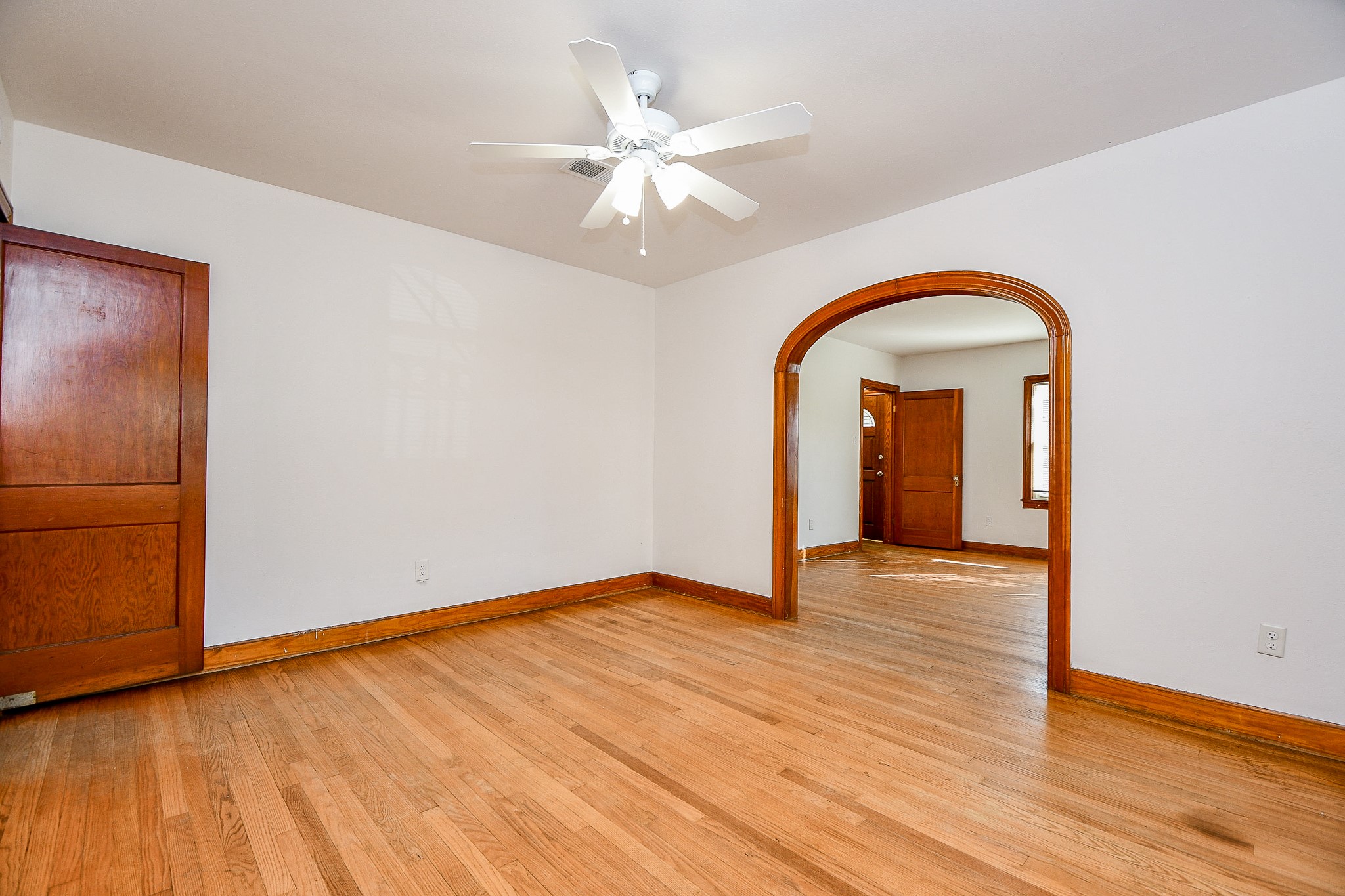 609 Milwaukee Street Houston, TX 77009 - Photo 22 of 32 a view of an empty room with wooden floor