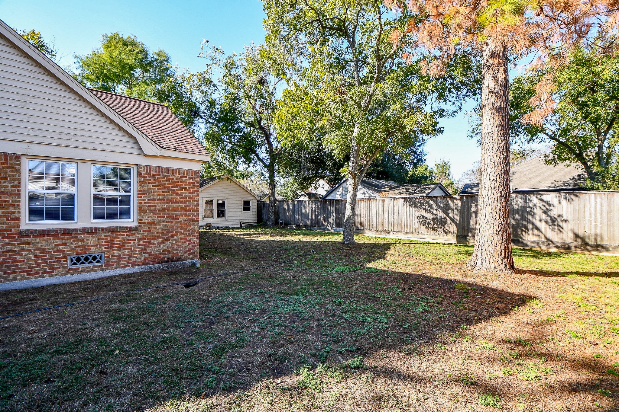 609 Milwaukee Street Houston, TX 77009 - Photo 32 of 32 a view of a house with backyard and trees