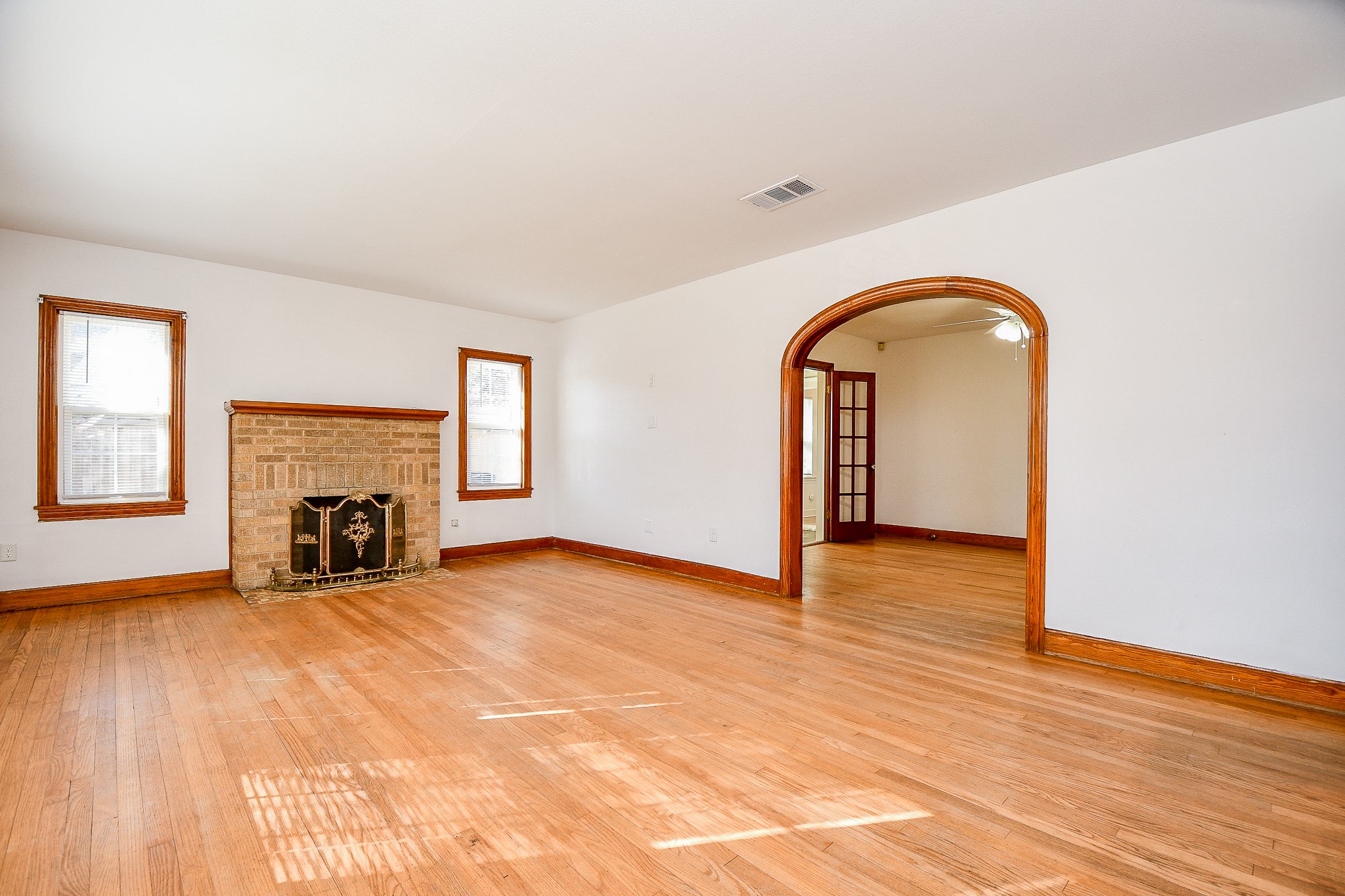 609 Milwaukee Street Houston, TX 77009 - Photo 4 of 32 a view of an empty room with window and fireplace