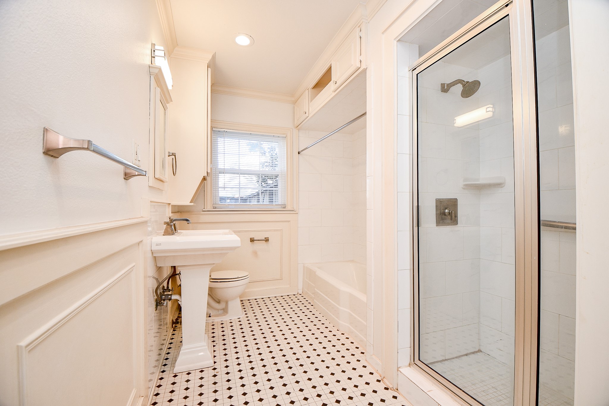 609 Milwaukee Street Houston, TX 77009 - Photo 9 of 32 a bathroom with a sink a toilet and shower