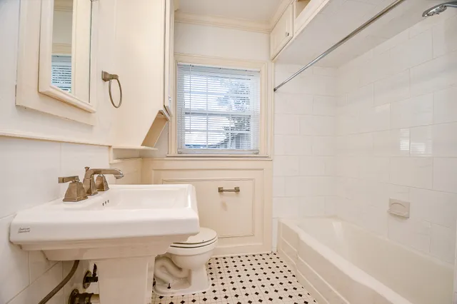 a bathroom with a sink a toilet and a bathtub