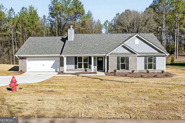 a house with trees in the background