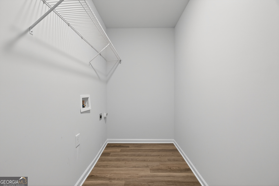 226 Airport Road, Unit 10 Canon, GA 30520 - Photo 23 of 43 a view of a room with wooden floor and white walls