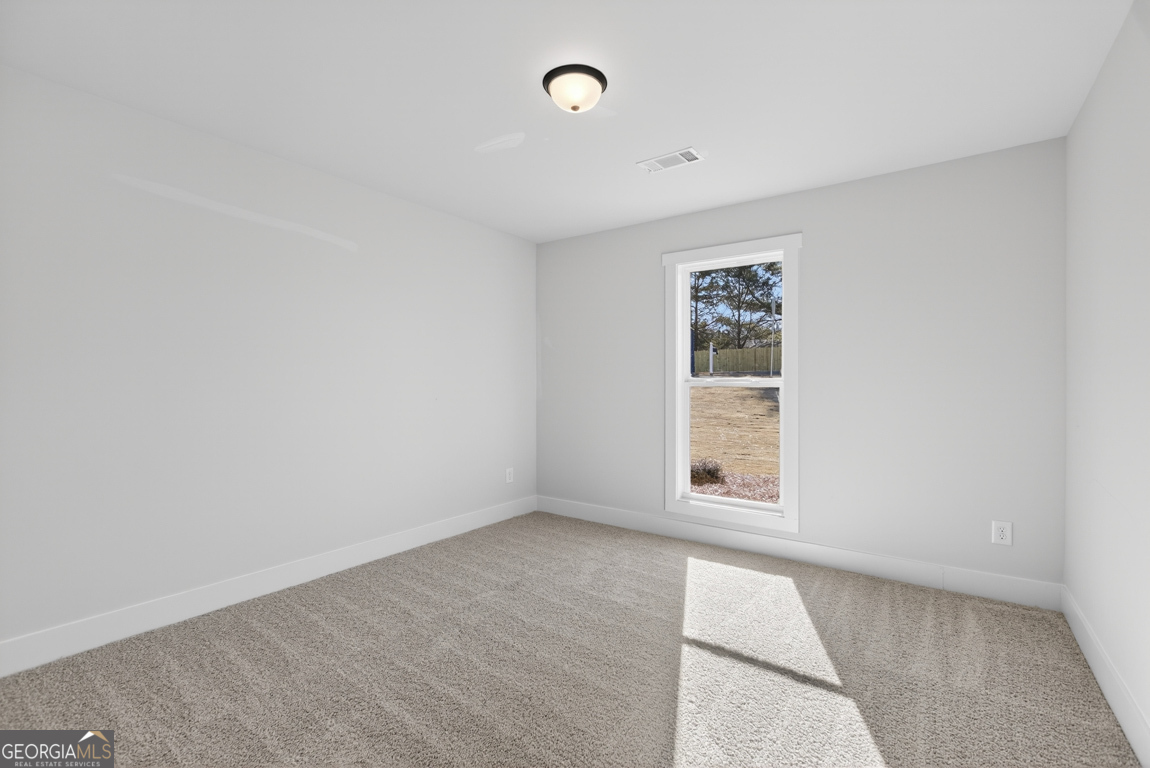 226 Airport Road, Unit 10 Canon, GA 30520 - Photo 24 of 43 an empty room with windows and closet