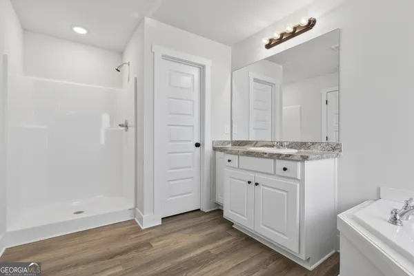 a bathroom with a bathtub and a sink