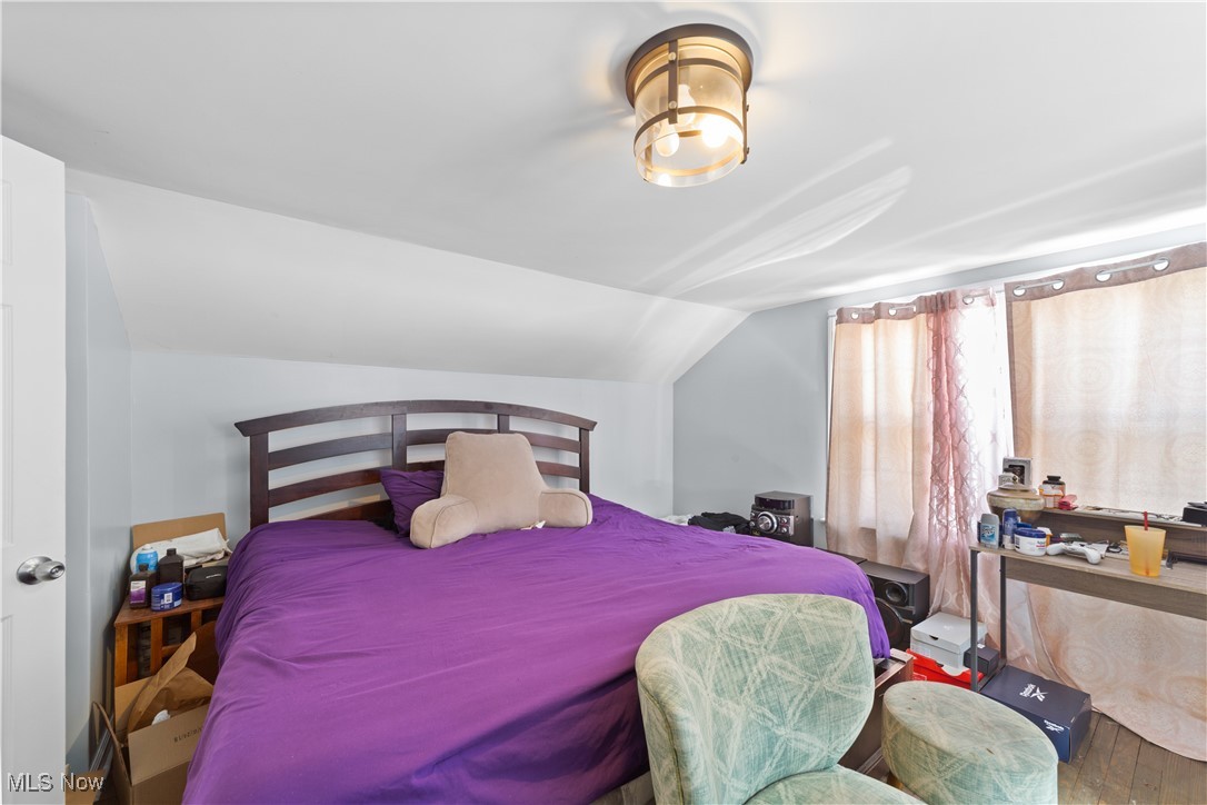 4249 Stonehaven Road Cleveland, OH 44121 - Photo 29 of 33 Bedroom with hardwood / wood-style flooring and lofted ceiling