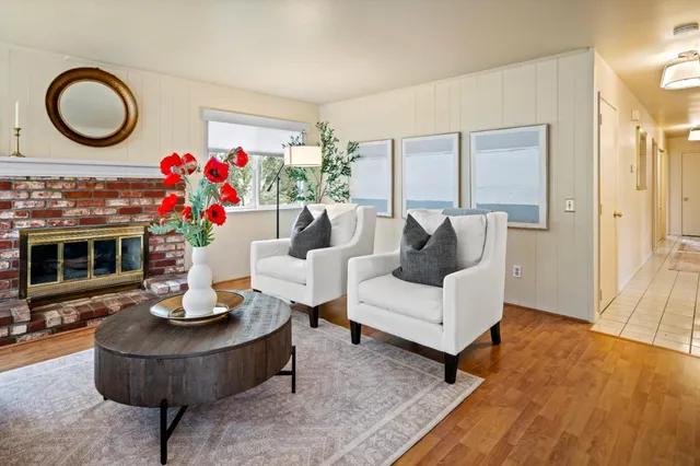 a living room with furniture and a fireplace