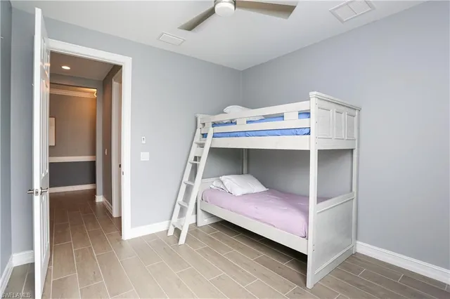 a bedroom with a bed and lamp