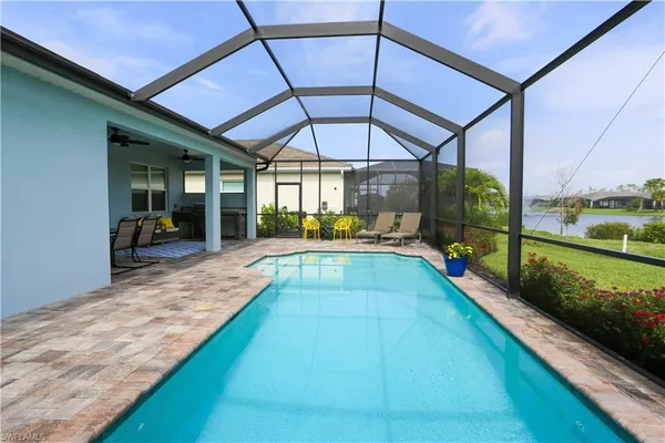 a view of swimming pool with a patio