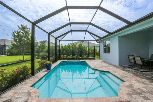 a swimming pool with a outdoor seating