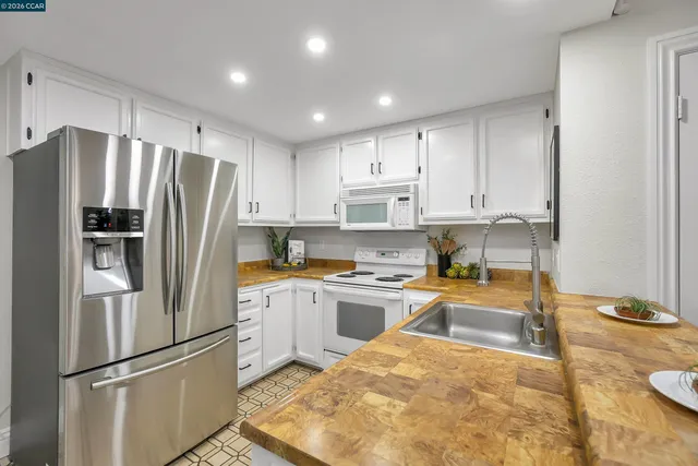 a bedroom with a bed plant and a window