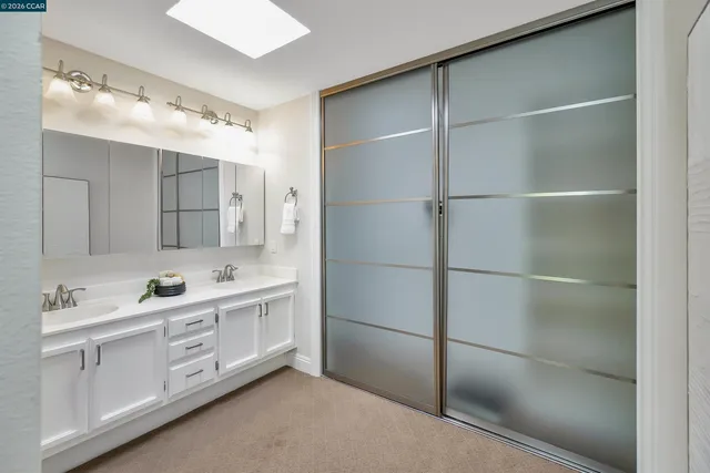 a view of a terrace with couches and wooden fence
