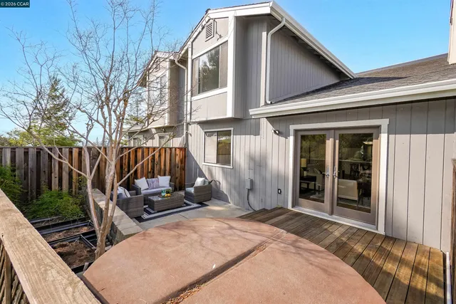 a front view of house with yard and outdoor seating