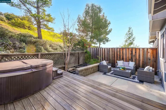 an aerial view of a house with a garden and lake view