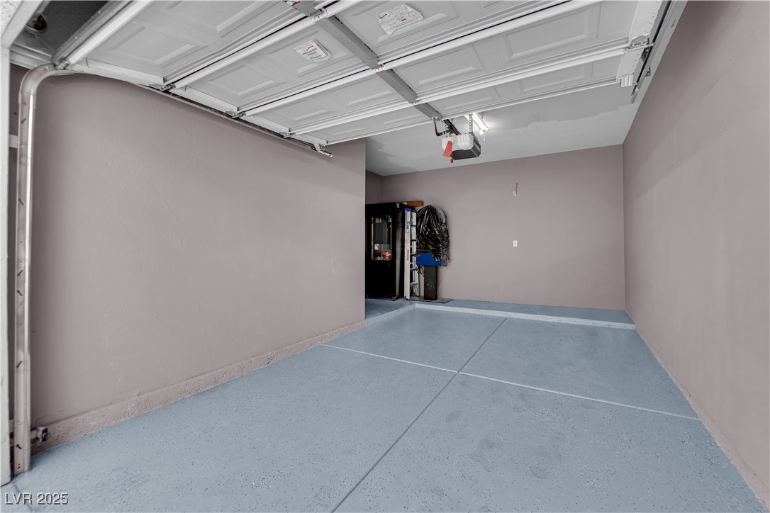 10550 West Alexander Road, Unit 2079 Las Vegas, NV 89129 - Photo 29 of 40 Garage featuring a garage door opener