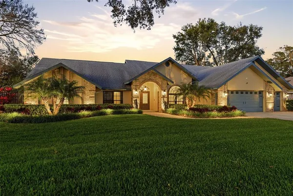 a view of a big yard next to a house