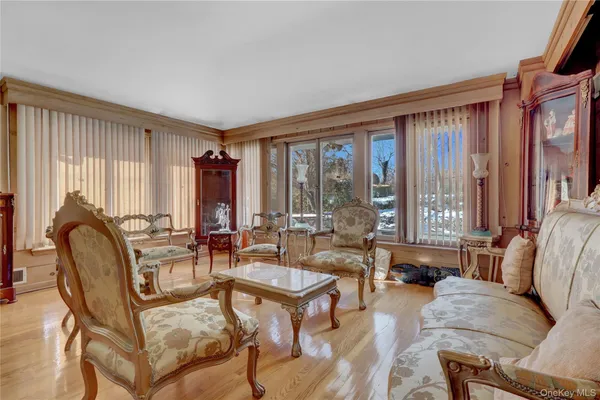 a living room with furniture and large windows