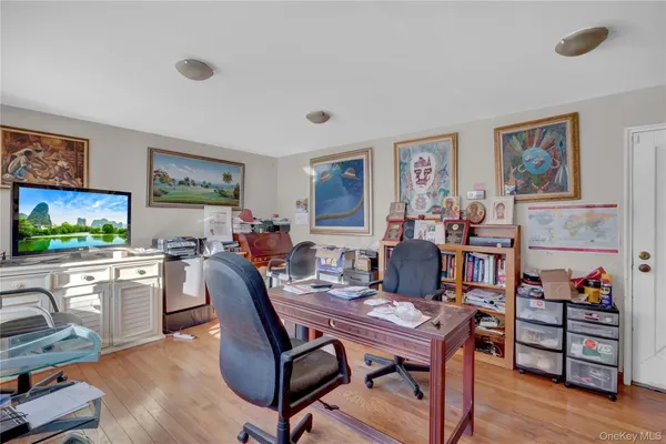 a view of a workspace with furniture and a livingroom