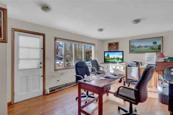 a workspace with furniture and window