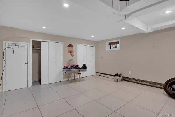 a view of a room with gym equipment and a view of living room