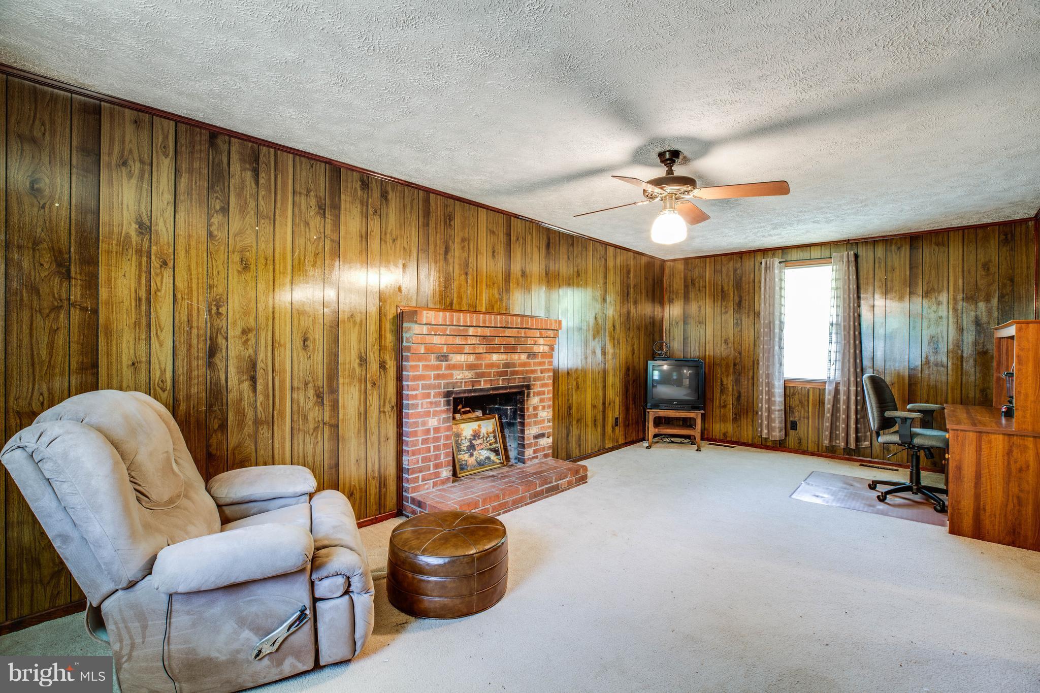 4314 Shepherds Road Partlow, VA 22534 - Photo 12 of 30 a view of a livingroom with furniture and a fireplace