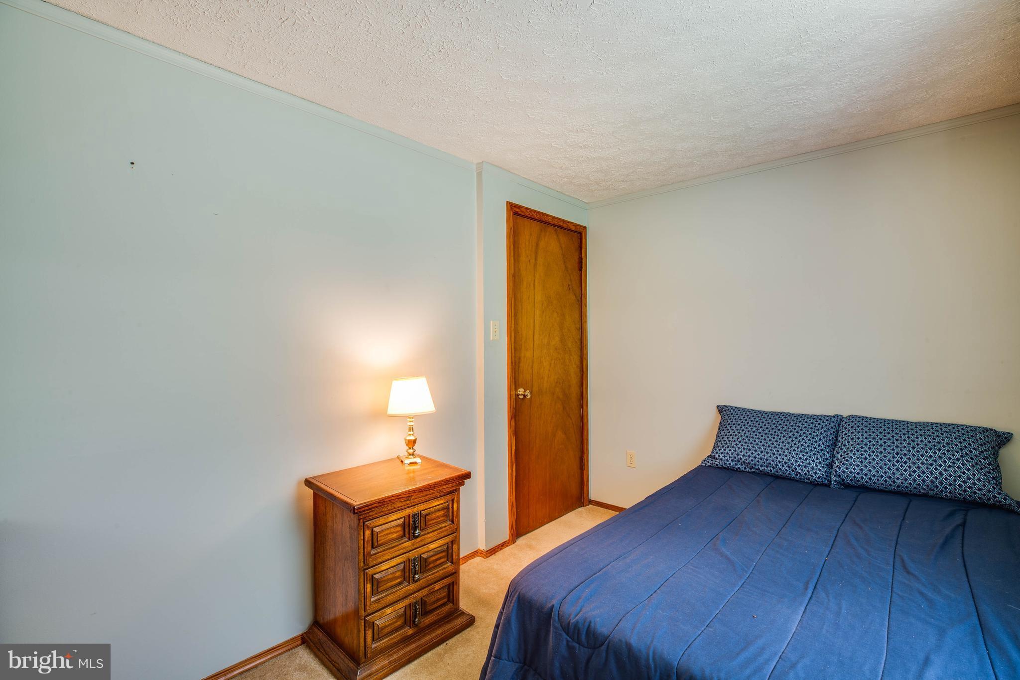 4314 Shepherds Road Partlow, VA 22534 - Photo 15 of 30 a bedroom with a bed and wooden floor