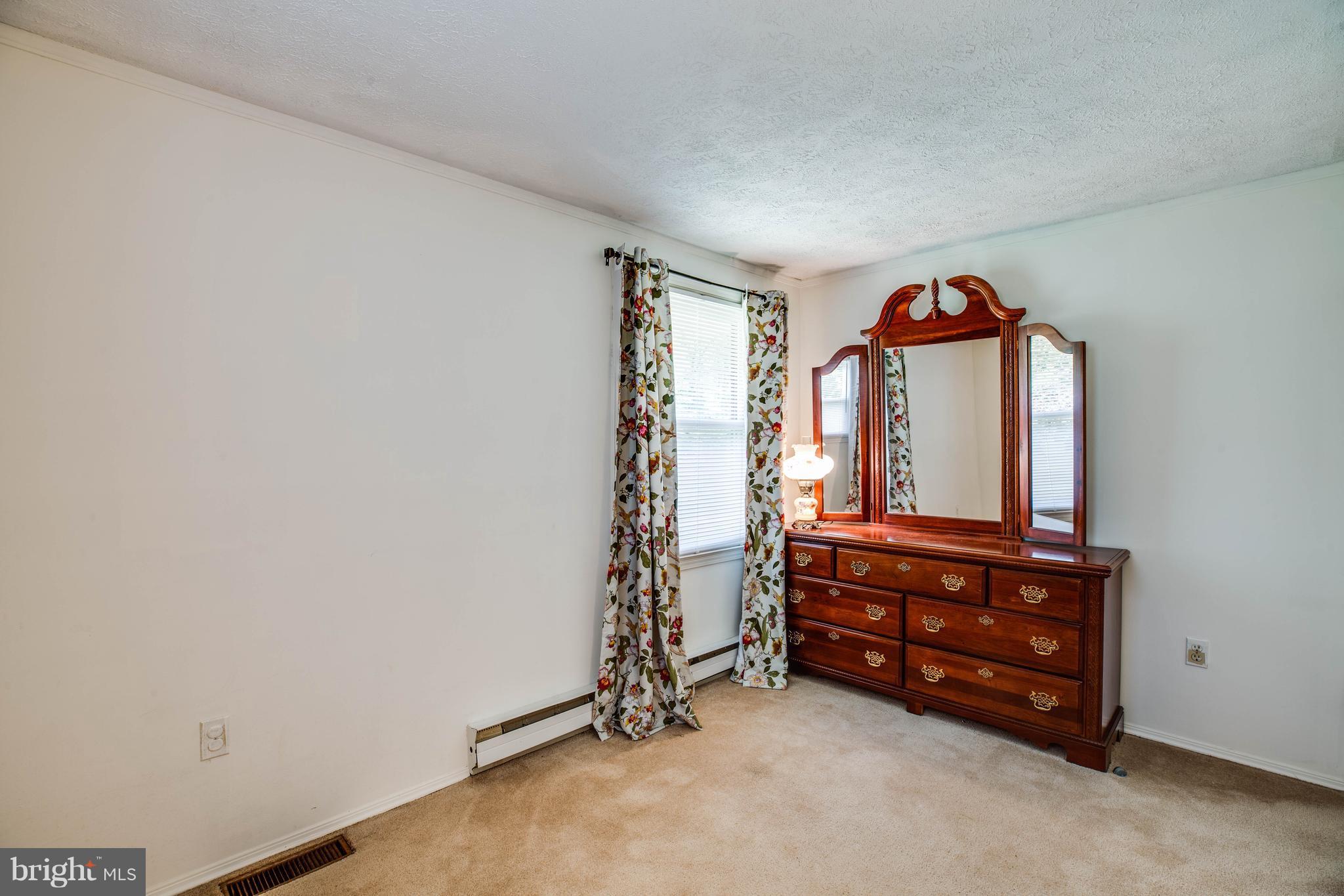 4314 Shepherds Road Partlow, VA 22534 - Photo 17 of 30 an empty room with window and mirror