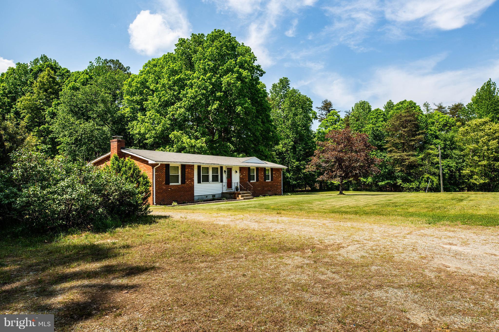 4314 Shepherds Road Partlow, VA 22534 - Photo 3 of 30 a front view of a house with a garden