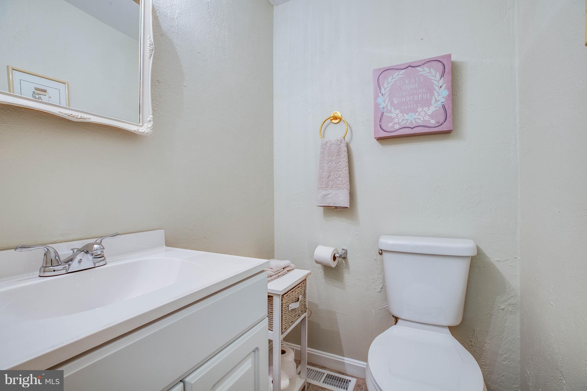 4314 Shepherds Road Partlow, VA 22534 - Photo 22 of 30 a bathroom with a toilet sink and mirror