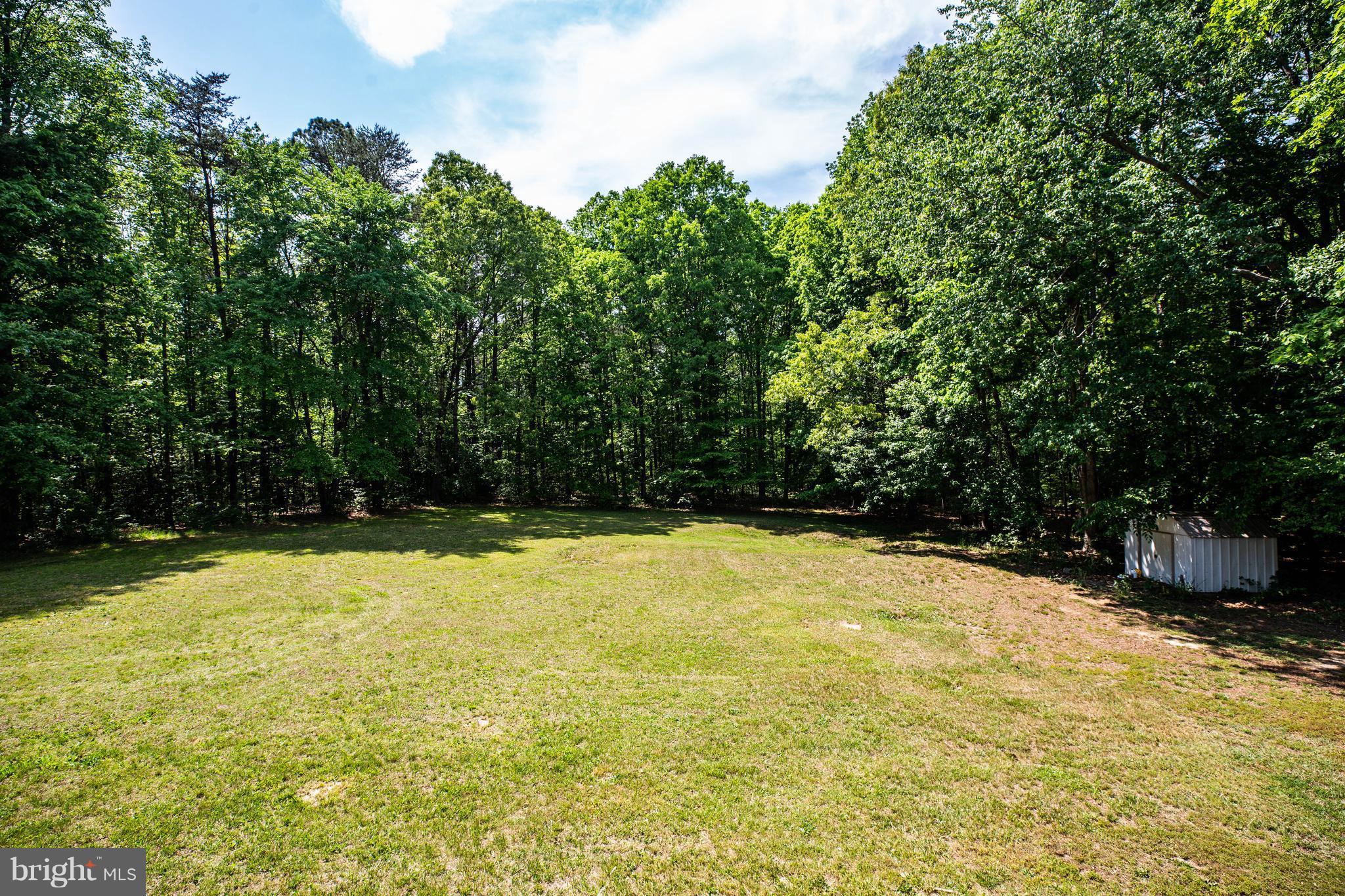 4314 Shepherds Road Partlow, VA 22534 - Photo 27 of 30 a view of a swimming pool with an outdoor space and seating area