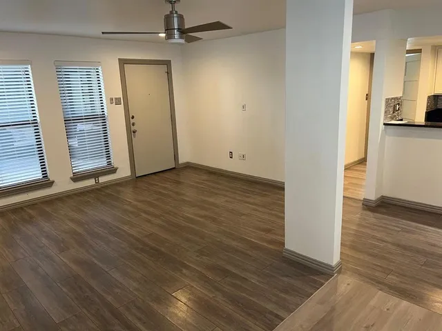 a view of kitchen with stainless steel appliances granite countertop a sink and a stove top oven